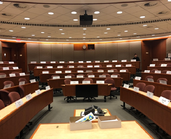 Empty circular classroom with name tags at each desk